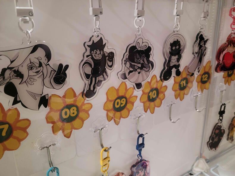 In Stars and Time Keychains displayed while tabling